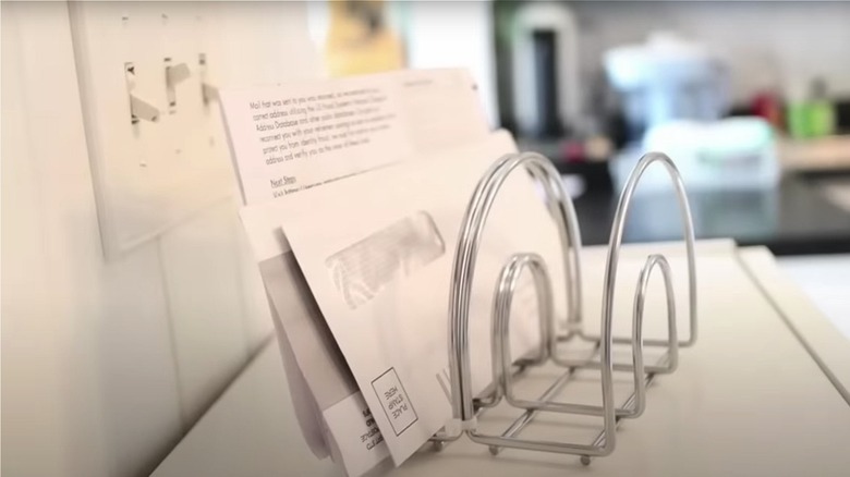sorting mail into napkin holder