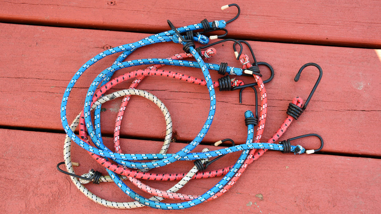 Bungee cords on wood floor