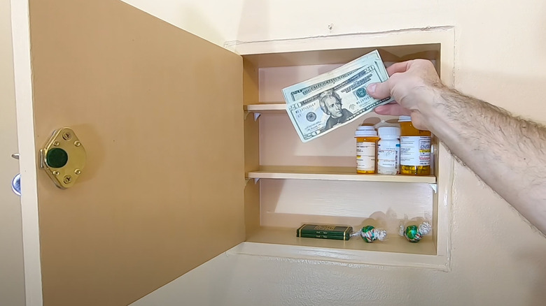 Keep Your Valuables Protected With This DIY Hidden Wall Safe