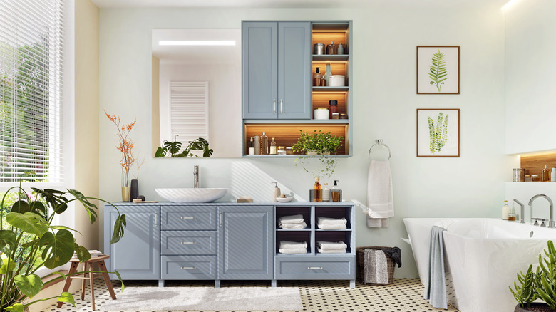 bathroom with plants and blue vaninty