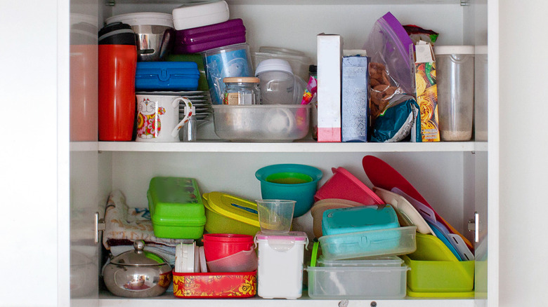 cluttered kitchen cabinet