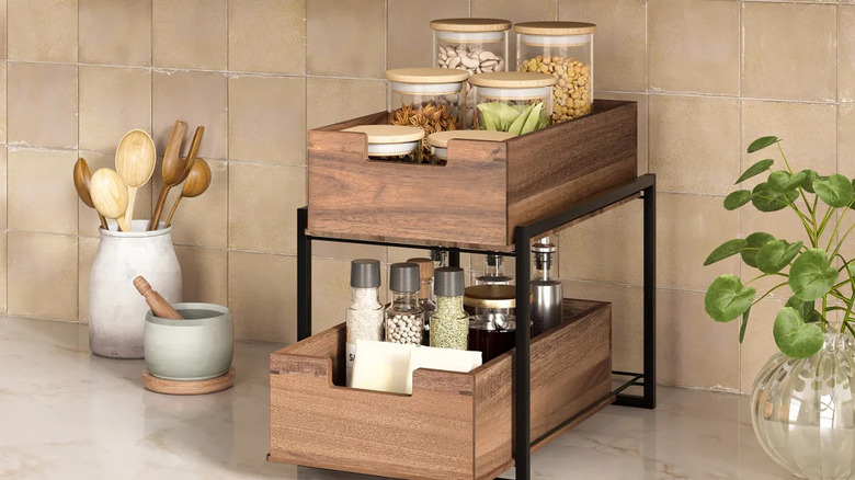 Seville Classics' 2-tier Acacia Sliding Bin filled with herbs and spices
