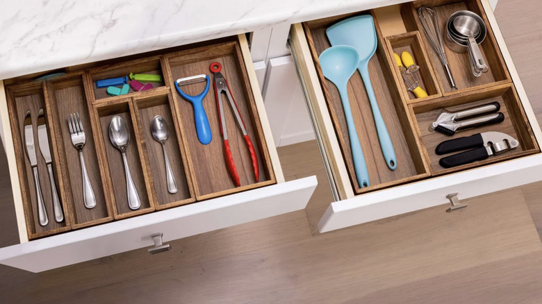 Seville Classics 10-piece box set in two kitchen drawers organizing silverware and kitchen utensils