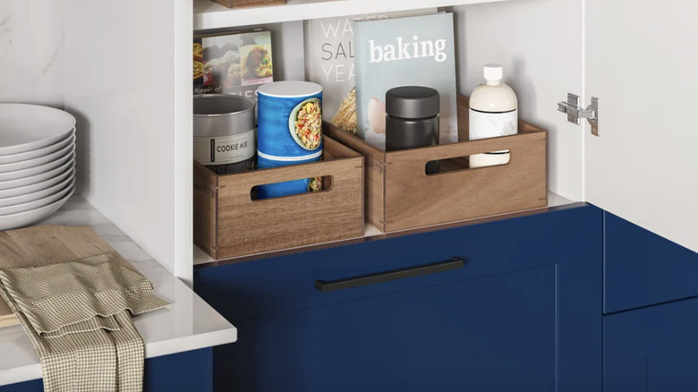 Seville Classics' organizer starter set on the bottom shelf of a pantry