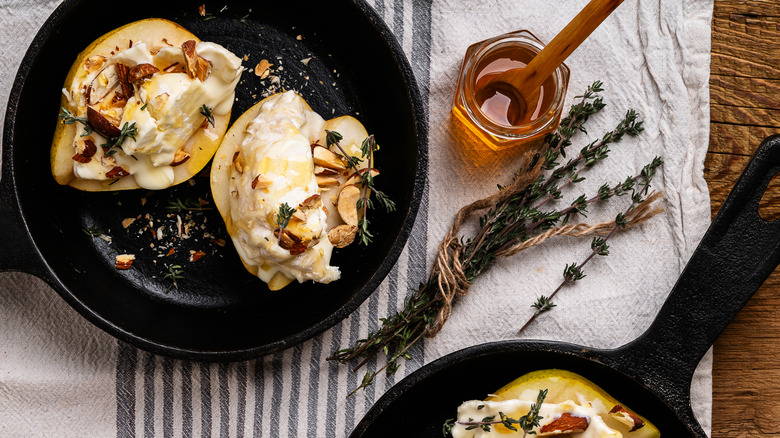 cast iron pans with stuffed pears in them