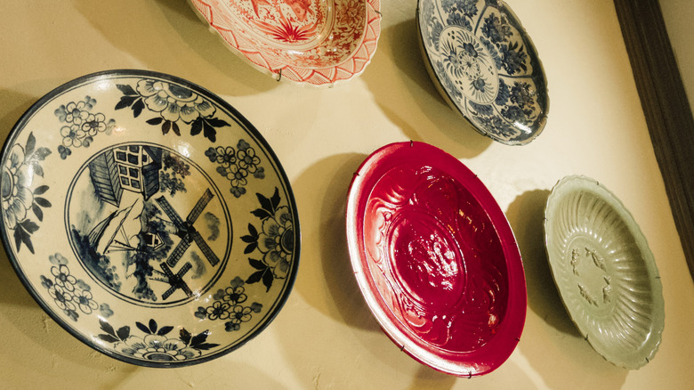Decorative plates hanging on the wall.