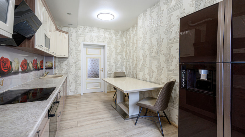 Contemporary style kitchen with textured wallpaper