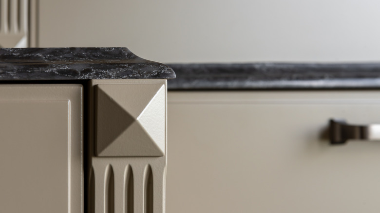 A gray granite countertop with ogee edge