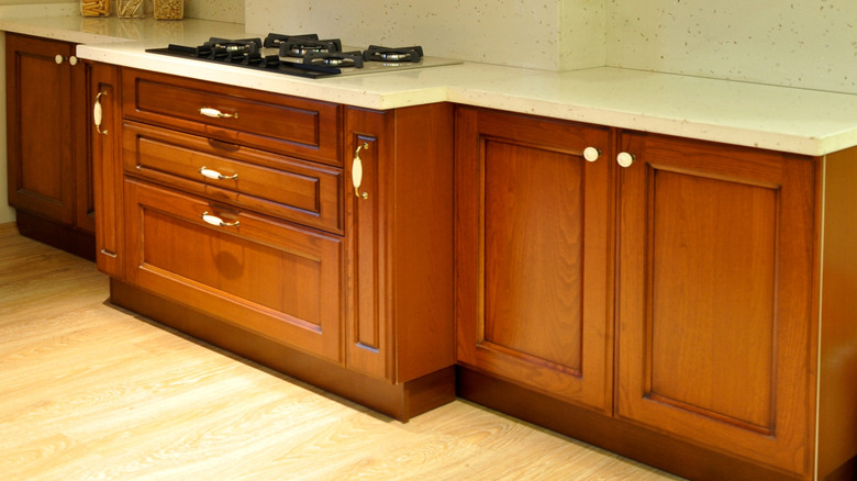 Warm, walnut lower cabinets