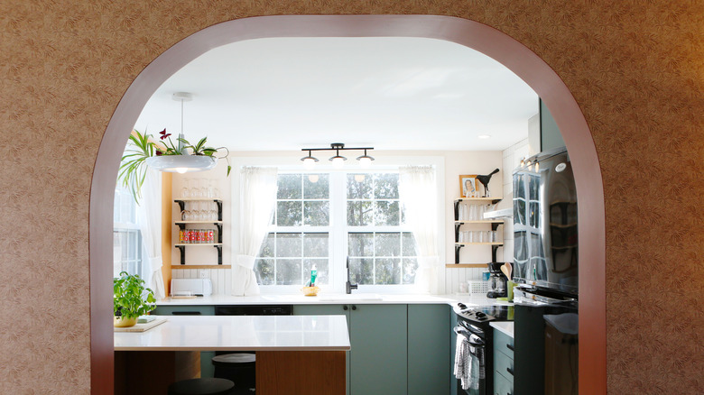 Arched doorway leading into kitchen