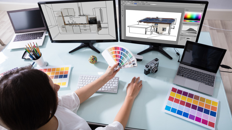 A designer working on a kitchen color scheme