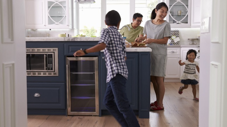 a busy family in the kitchen
