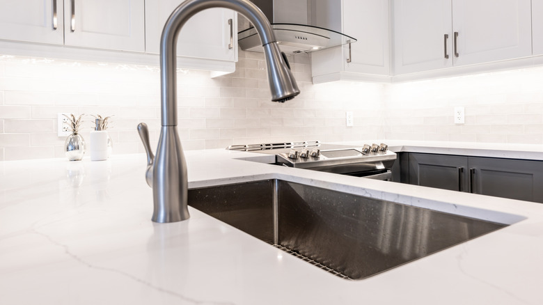 White quartz countertop in modern kitchen