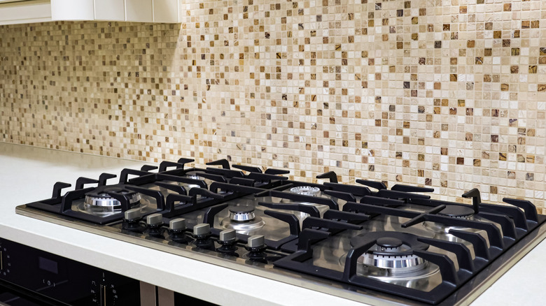 Kitchen with mosaic backsplash