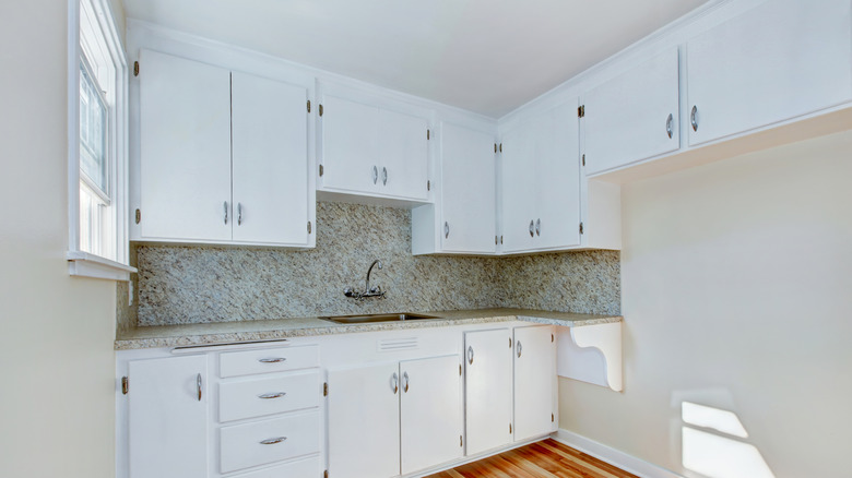 Kitchen with large bank of upper cabinets