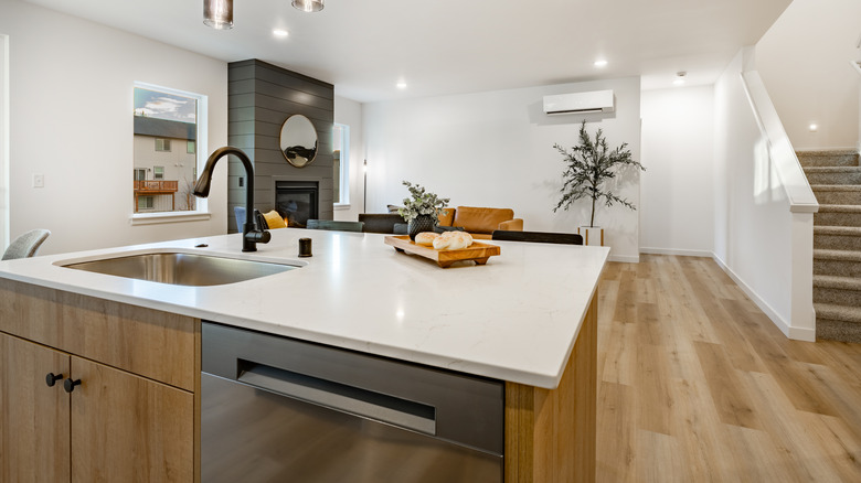 A kitchen island with a sink in it.