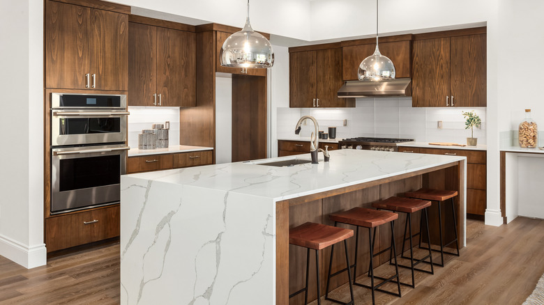 A kitchen with wood grain cabinets.