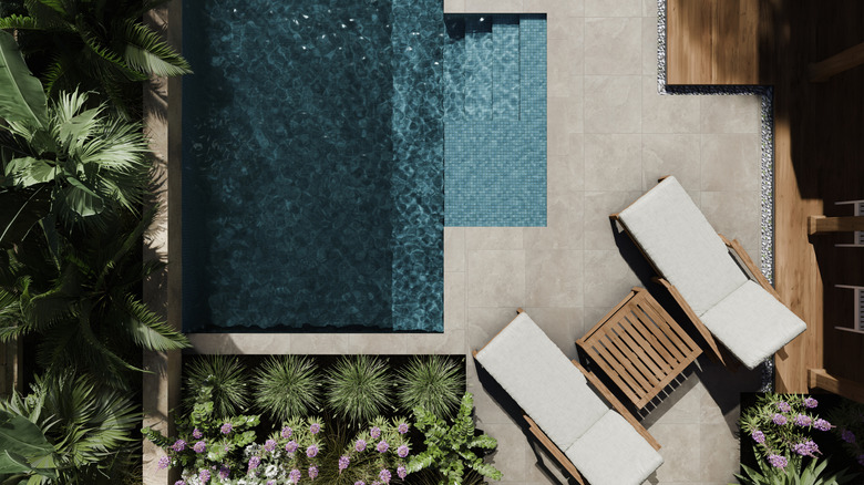 aerial viewof a back yard's landscaping with pool and patio