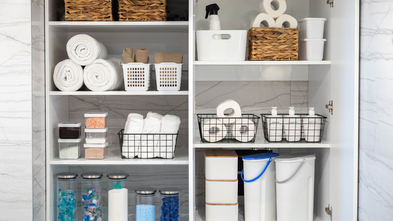A laundry room with plenty of baskets for supplies