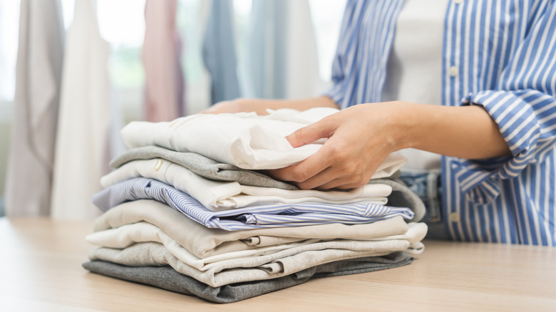 An up close look at a white dresser with four drawers.