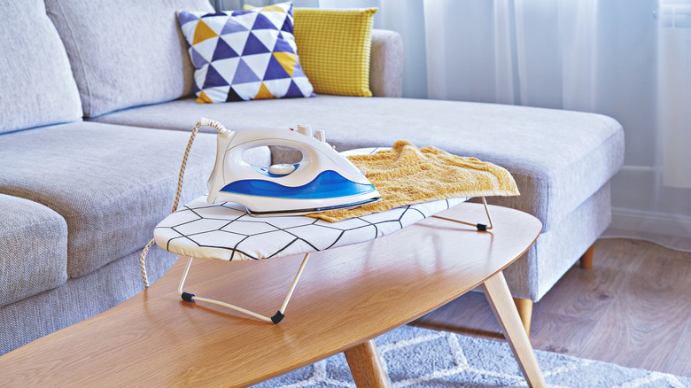 A small tabletop ironing board