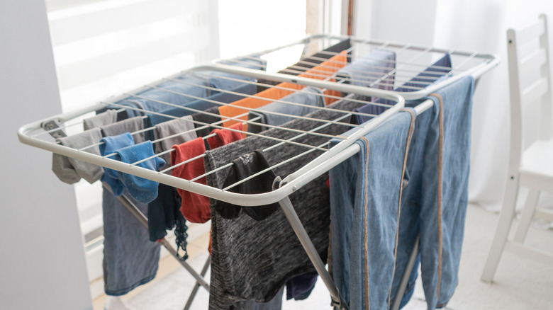 Clothes hanging on a silver-colored drying rack