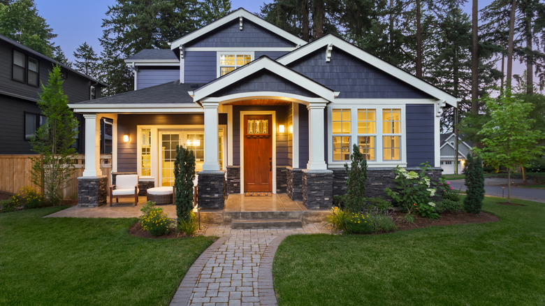 landscaping and blue house