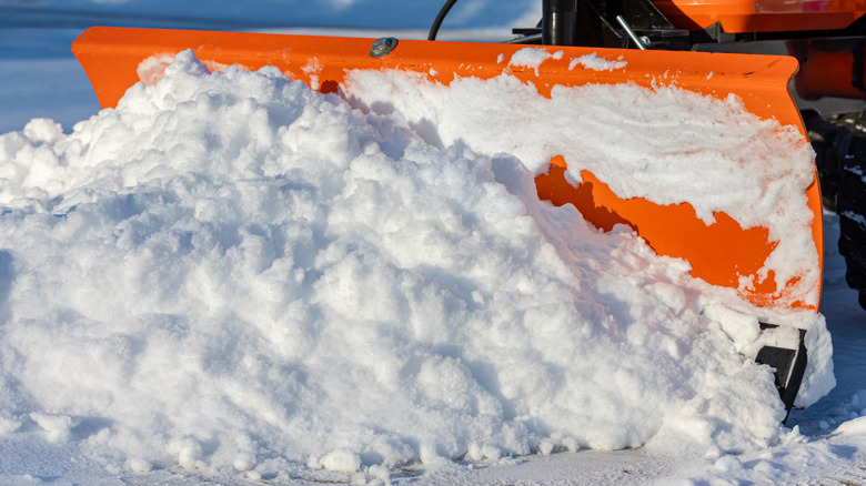 Plowing deep snow with a lawn tractor