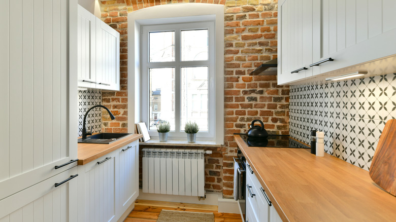 kitchen with brick wall