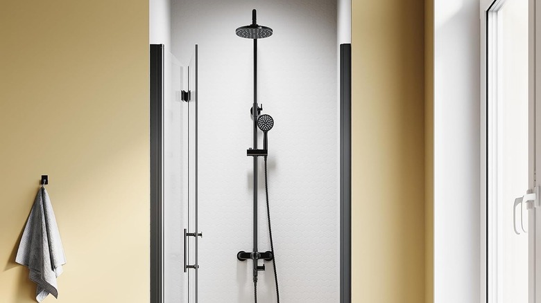 A shower cubicle with a bi-fold glass door