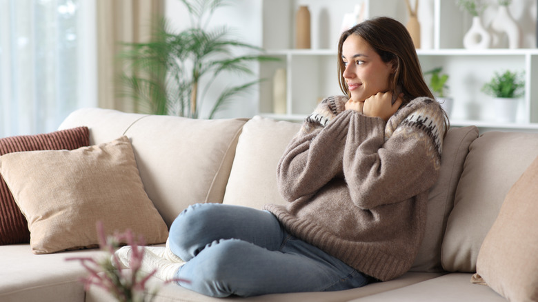 Woman sitting on couch