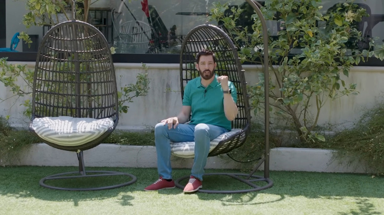 Drew Scott shows off his backyard seating area