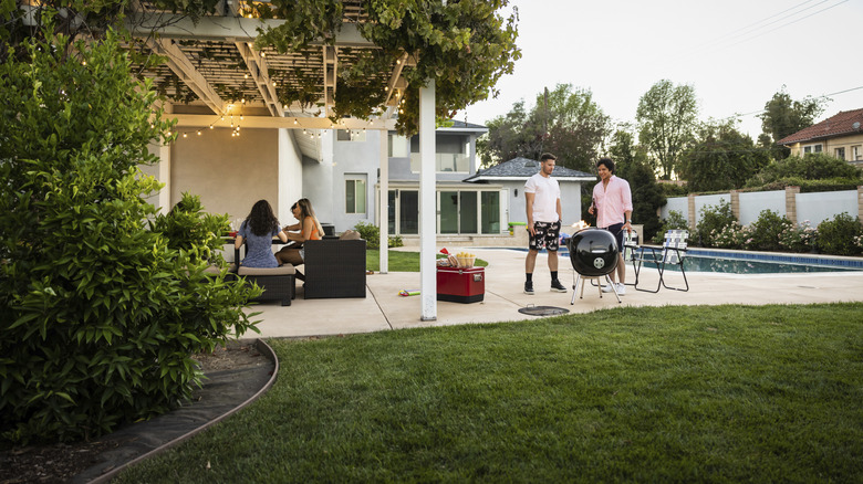 A backyard with friends gathering.
