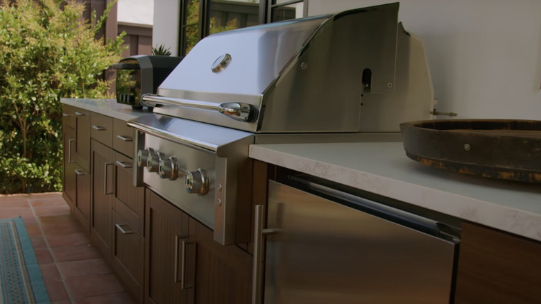 An outdoor kitchen in a backyard