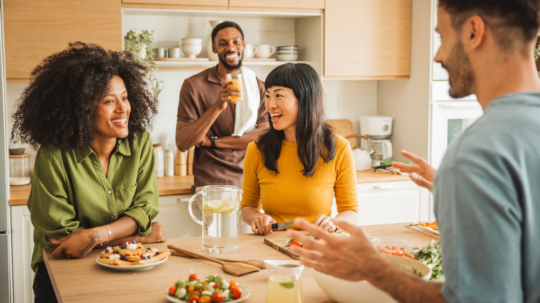 people having dinner party at table