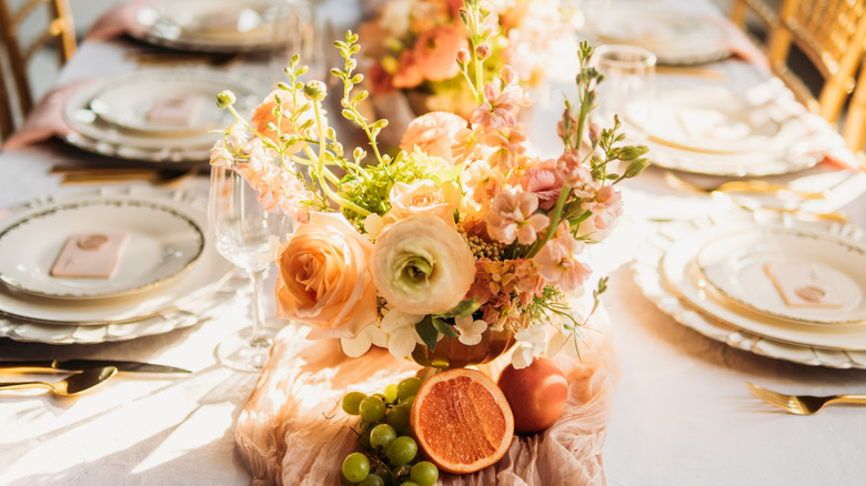 Beautiful tablescape flowers with white tablecloth background