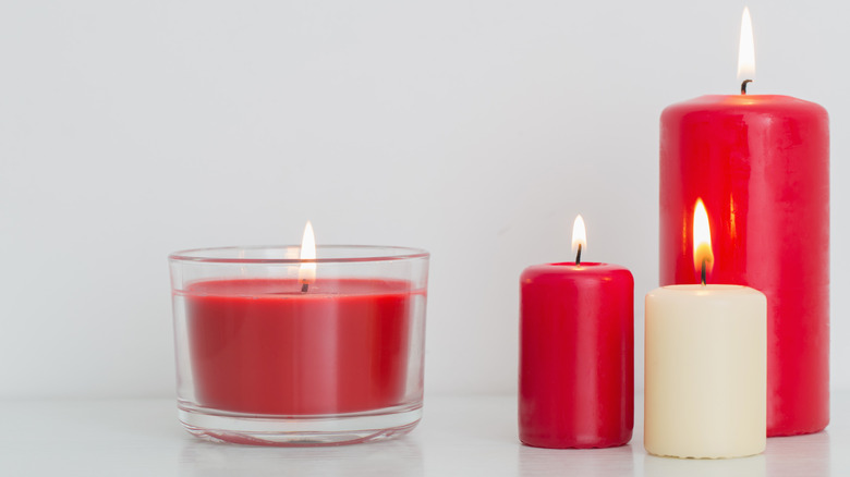 Red and white candles burning