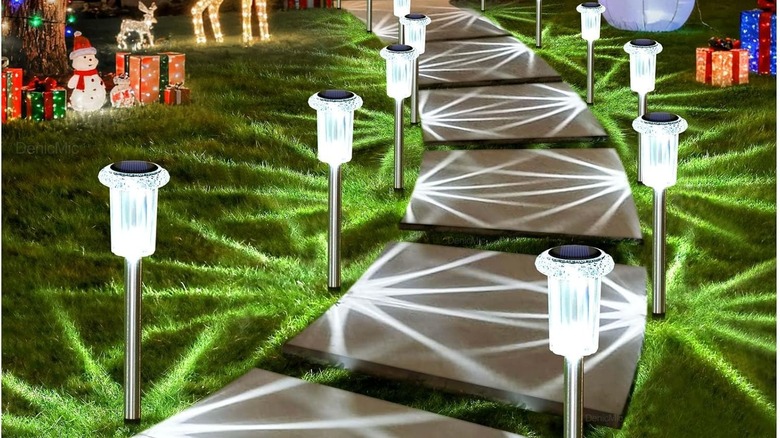 Solar stake lights along a walkway in a yard