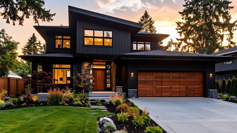 A contemporary home at dusk with minimal outdoor lighting