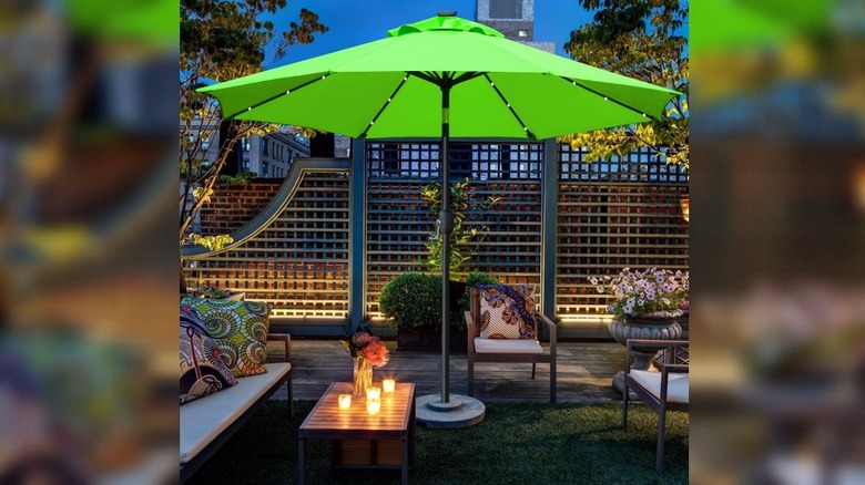 The Sunnyglade Patio Umbrella with its LED lights at night.