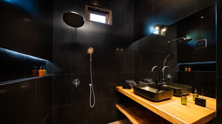shower with dark tiles