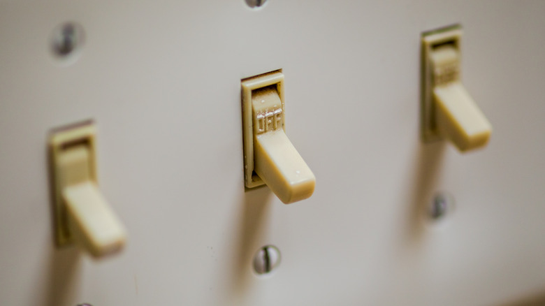 close up of old standard light switches
