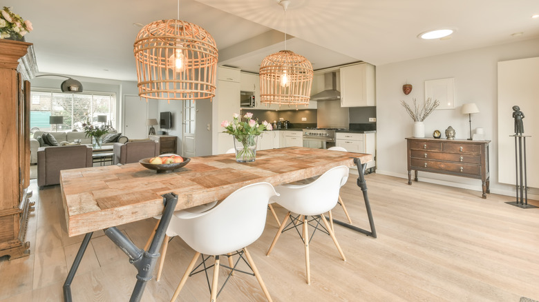 two large pendant lights over kitchen table