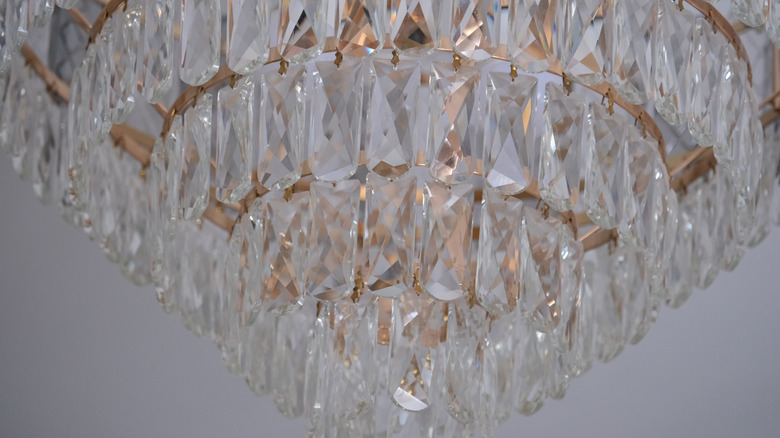 A close-up of a crystal statement chandelier