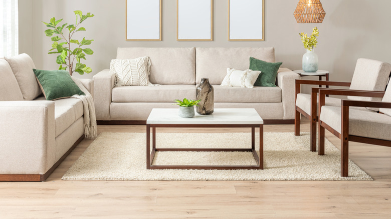 A modern living room laid with light wood flooring