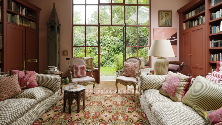 A living room with two matching sofas and two matching chairs