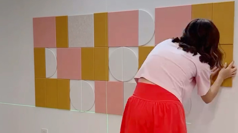 Woman making felt wall mural