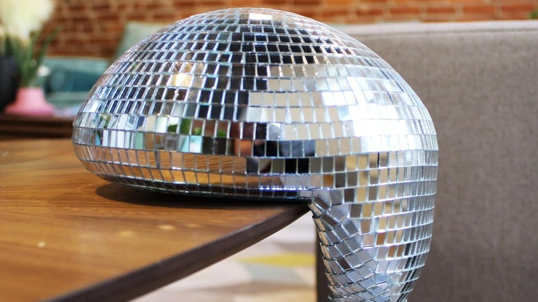 disco ball melting on the edge of a table