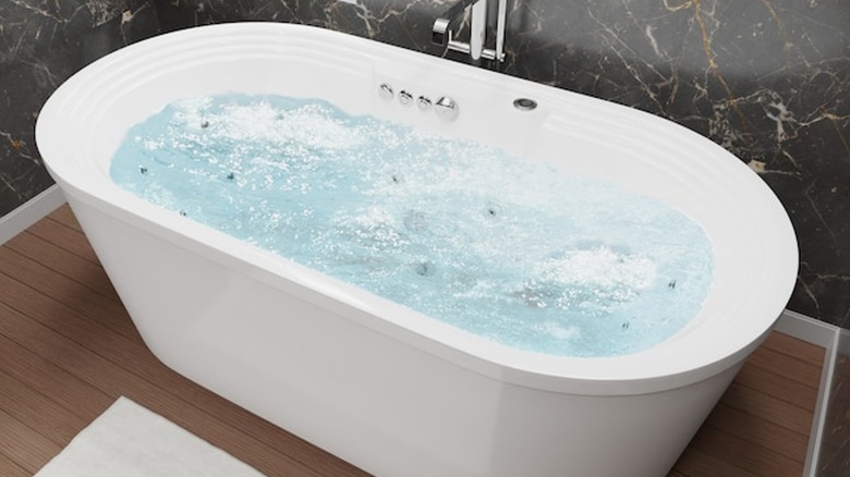 freestanding Anzzi oval tub with jets
