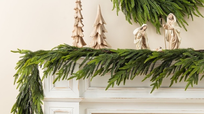 faux Glitzhome pine garland on mantel